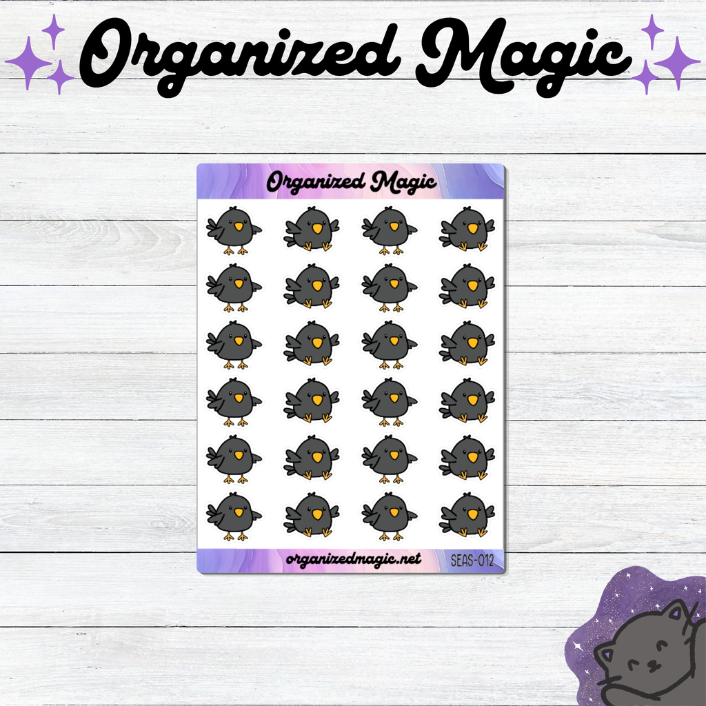A sheet of planner stickers featuring a grid of cute gray doodle blackbirds displayed on a white wood background with decorative purple branding elements.