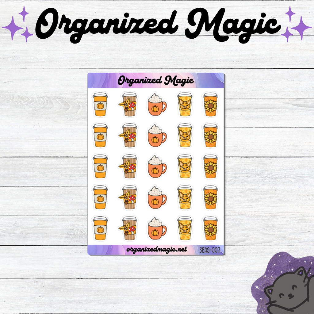 A sticker sheet from Organized Magic featuring autumn-themed coffee cup illustrations, displayed on a white wood background with decorative purple text and a cat illustration.