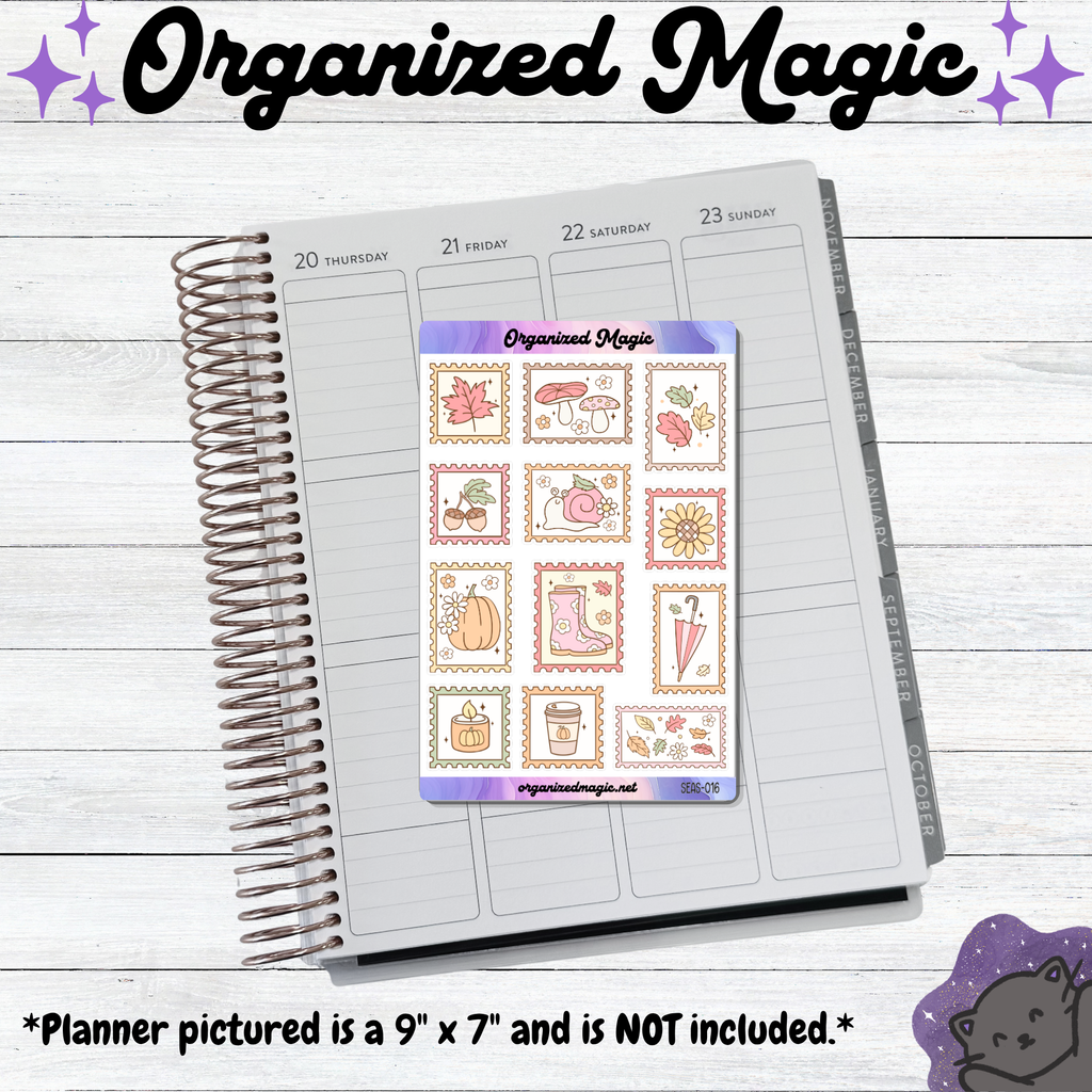 An open spiral planner on a light wood background with a sticker sheet titled 'Organized Magic' placed on the page. The sticker sheet has autumn-themed illustrations such as leaves, mushrooms, pumpkins, and rain boots. Planner not included.