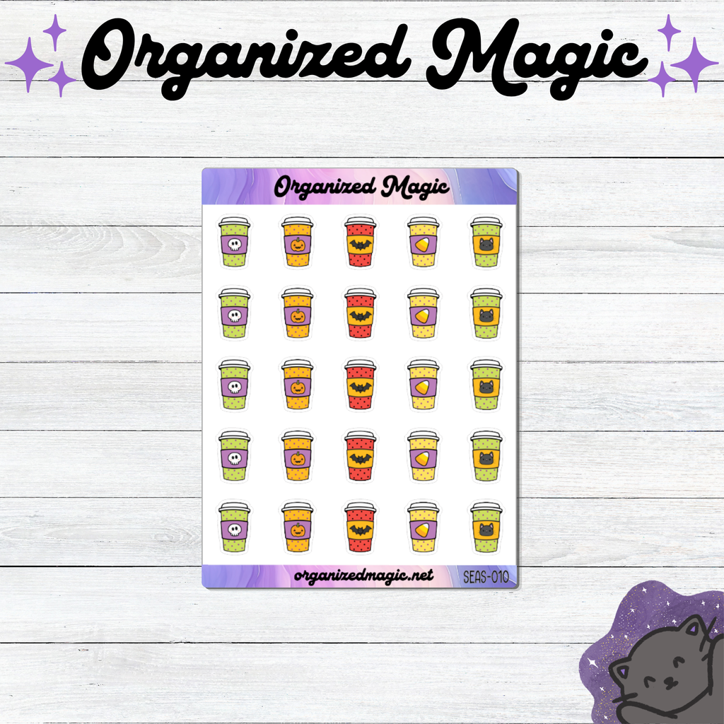 A sticker sheet from Organized Magic featuring rows of cute Halloween-themed coffee cup planner stickers, displayed on a white wood background with the brand name 'Organized Magic' at the top.