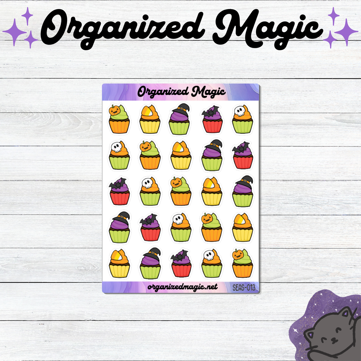 A sheet of Halloween-themed planner stickers featuring colorful cupcakes with pumpkins, ghosts, and witch hats, displayed on a white wood background with 'Organized Magic' branding.