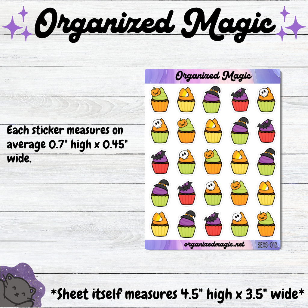 A sticker sheet featuring colorful Halloween-themed cupcake stickers on a white sheet, displayed on a light wood background with text detailing the sticker and sheet measurements. The brand name 'Organized Magic' is visible at the top and on the sticker sheet.