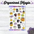 A sheet of Halloween-themed stickers from Organized Magic, featuring cute doodle illustrations of ghosts, black cats, pumpkins, skulls, candy corn, spiders, coffins, stars, and 'boo' speech bubbles, displayed on a white wood background with decorative text.
