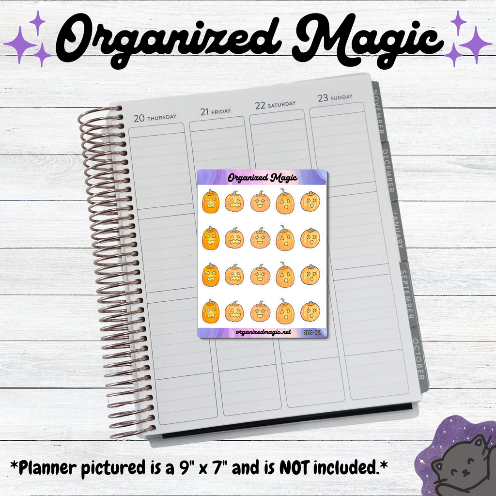 A planner page spread on a white wood background with a sticker sheet placed on top. The sticker sheet reads 'Organized Magic' and shows multiple orange pumpkin faces with small decorative icons. Planner not included.