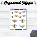 A sheet of bee and moth themed planner stickers with suns and moons displayed on a white wood background, with decorative 'Organized Magic' branding at the top and a purple cat silhouette in the bottom right corner.