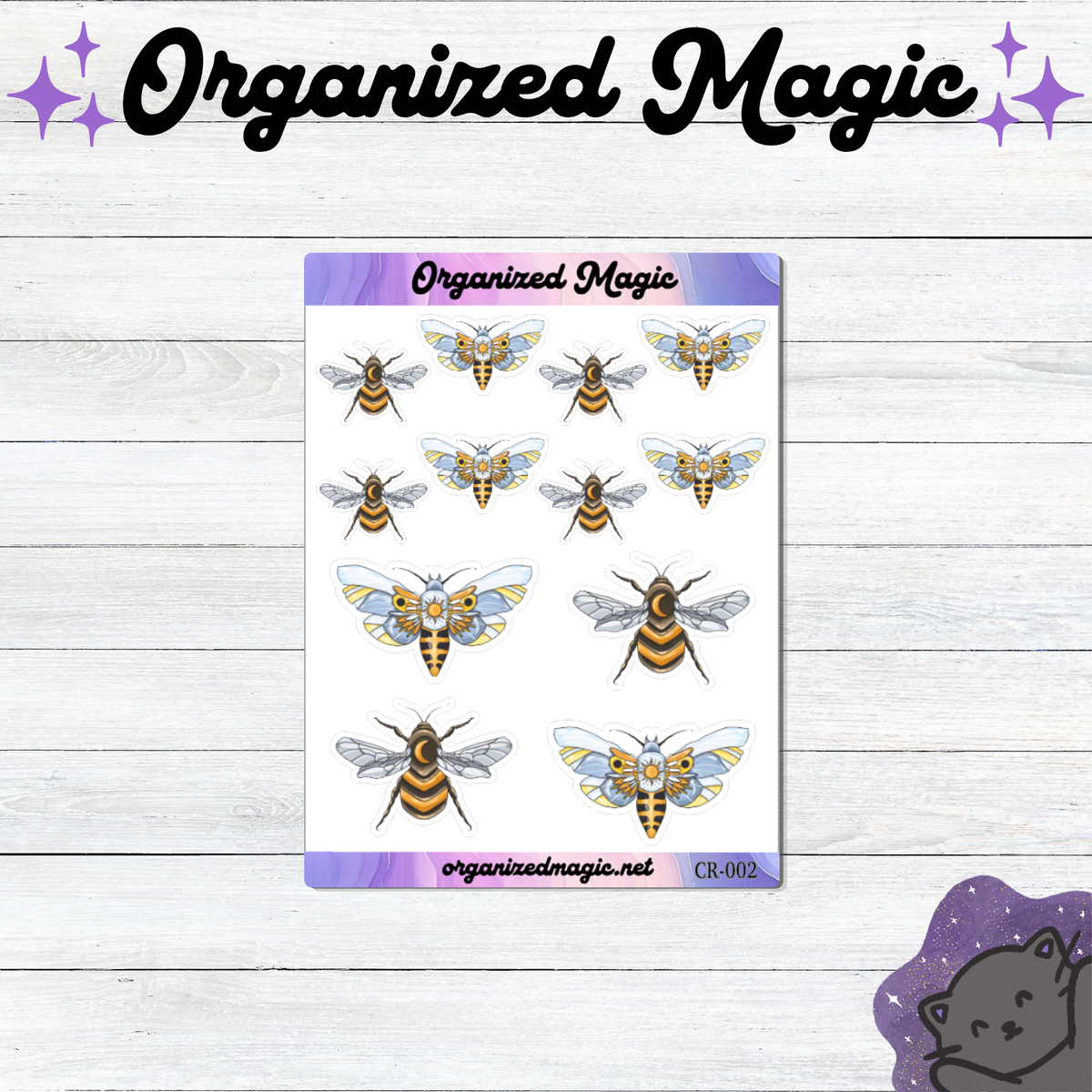 A sheet of bee and moth themed planner stickers with suns and moons displayed on a white wood background, with decorative 'Organized Magic' branding at the top and a purple cat silhouette in the bottom right corner.