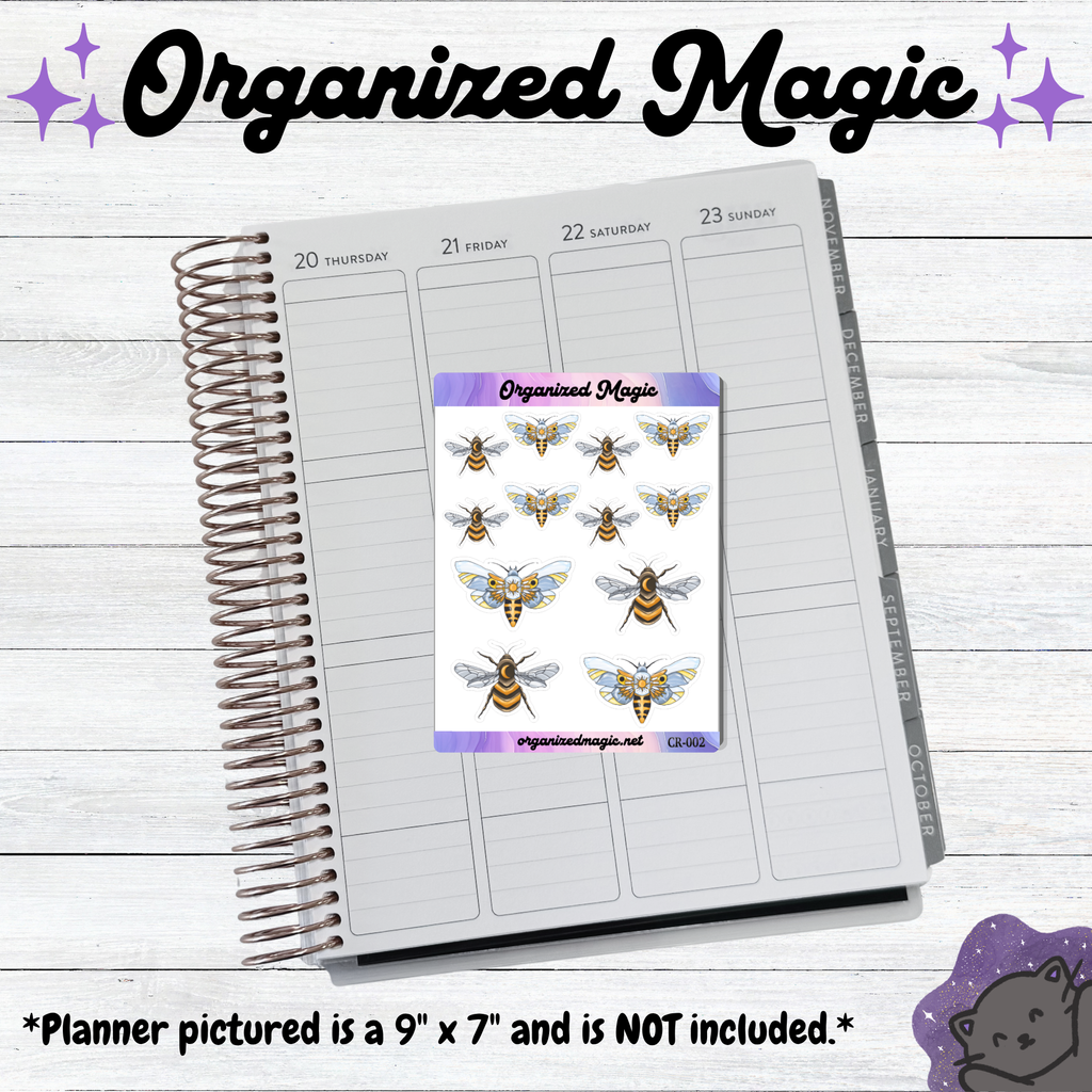 A spiral-bound planner page with weekly columns and a sticker sheet placed on top. The sticker sheet reads 'Organized Magic' and shows illustrated bees and moths on a white background with purple borders. Planner displayed is not included.