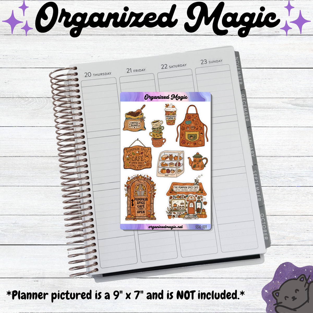 A spiral-bound planner page shown on a whitewashed wood background, with a sticker sheet featuring coffee-themed illustrations placed on the page. The sticker sheet is branded 'Organized Magic' and includes drawings of a coffee shop, apron, mug, and other coffee accessories.