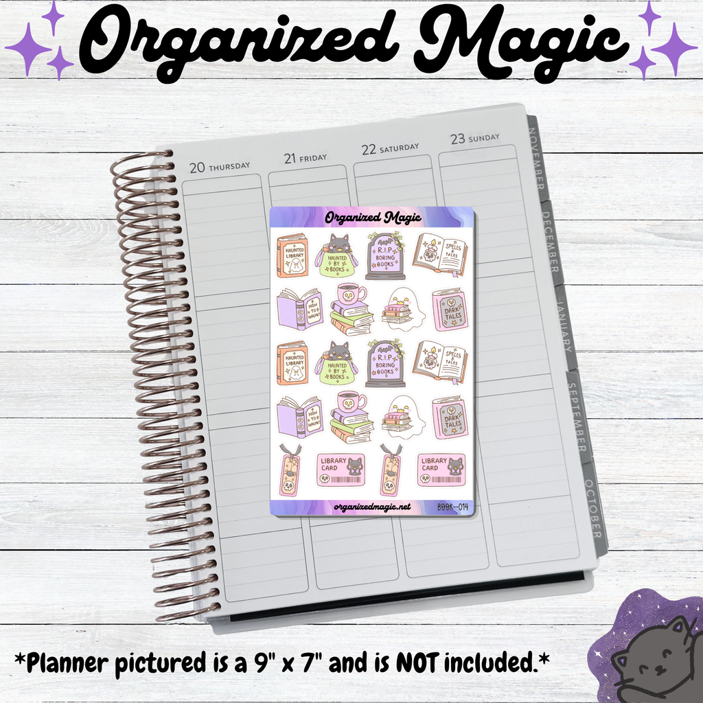 A spiral-bound planner page is shown on a whitewashed wood background, with a sheet of decorative planner stickers placed on top. The stickers feature cute doodle illustrations of books, black cats, and ghosts.