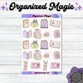 A sheet of planner stickers themed around books and libraries, featuring cute illustrations of a gray cat, open books, stacks of books, library cards, and tombstones with humorous quotes. The sheet is displayed on a white wood background with decorative purple text reading 'Organized Magic' at the top.